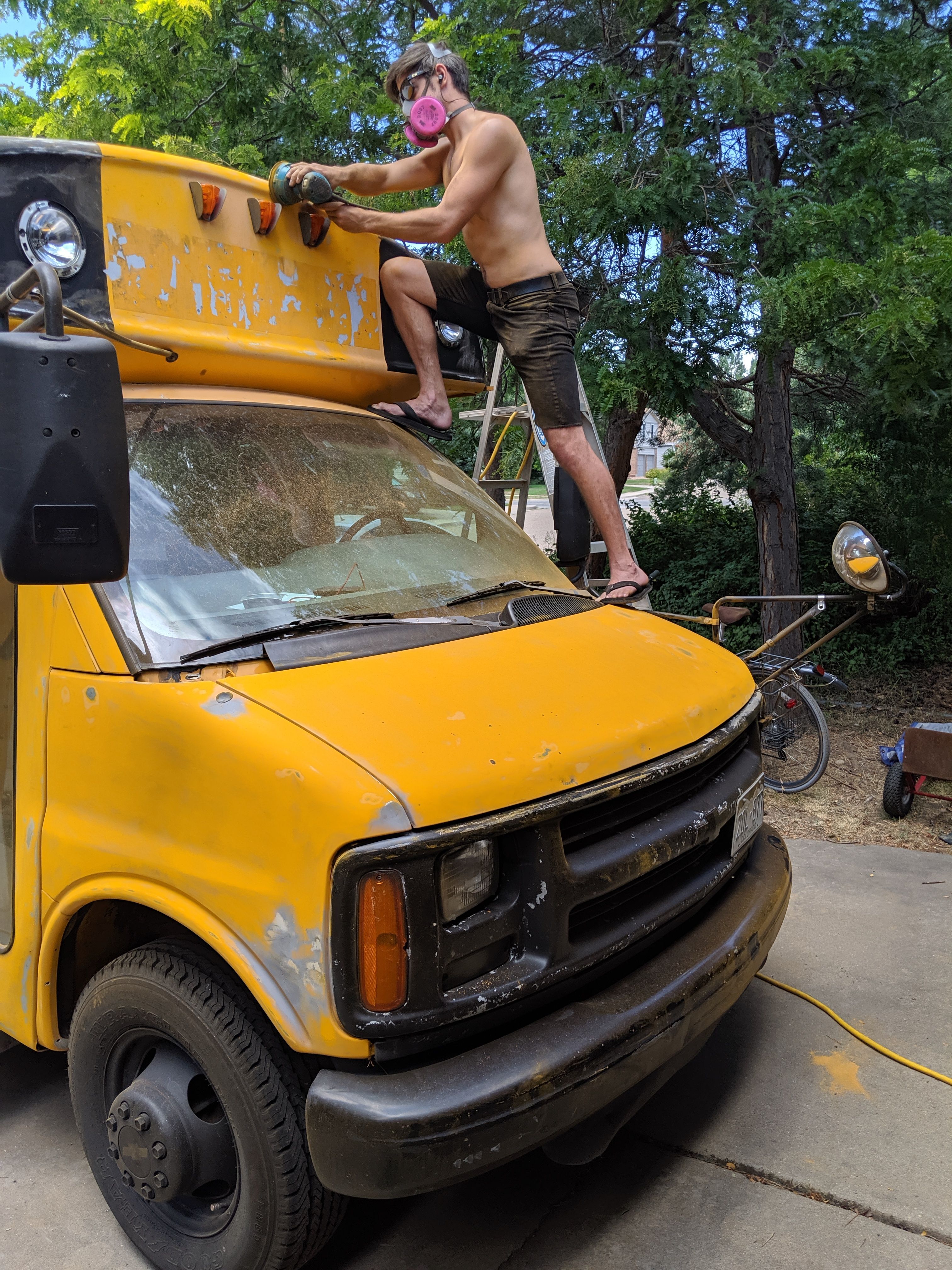 The author sanding his bus.